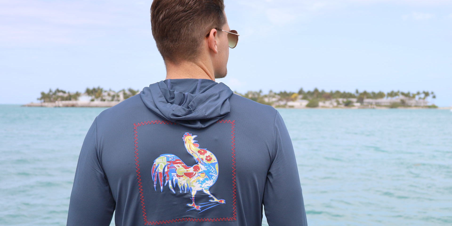 two men in pink and blue shirts with patchwork graphic