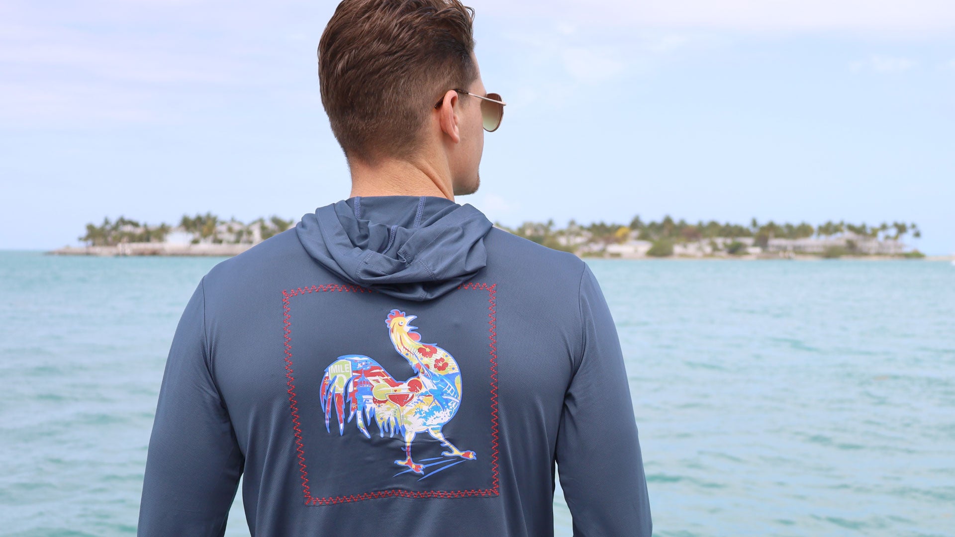 two men in pink and blue shirts with patchwork graphic