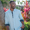 Man-Wearing-Caribbean-Blue-Linen-Shirt-Flamingo-Accent-Cuffs